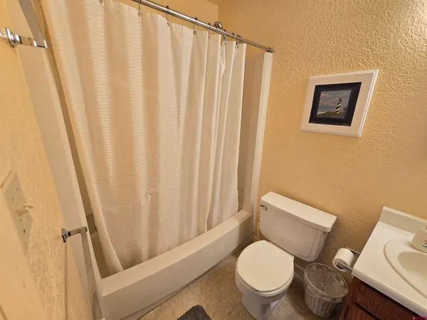 a bedroom with a bed and furniture