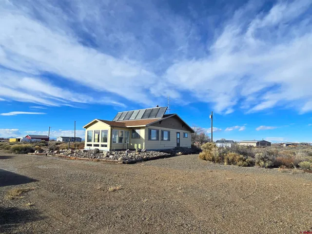 a view of house with outdoor space
