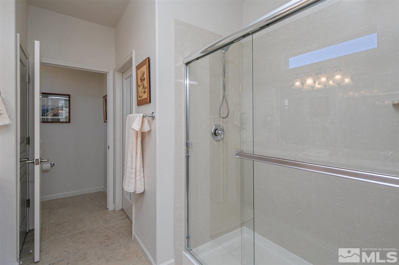 1420 Wakefield Trail Reno, NV 89523 - Photo 12 of 23 a bathroom with a shower