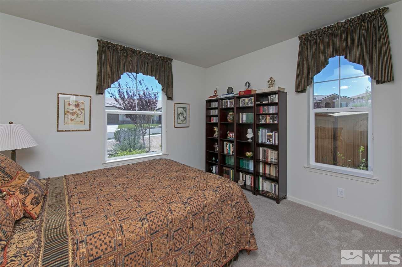 1420 Wakefield Trail Reno, NV 89523 - Photo 14 of 23 a bed sitting in a bedroom next to a window