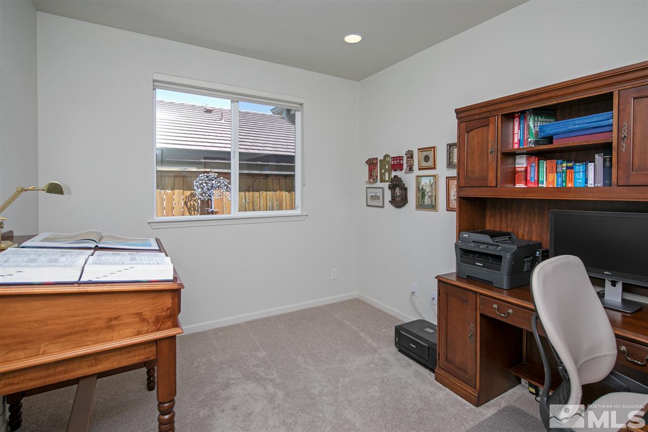 1420 Wakefield Trail Reno, NV 89523 - Photo 15 of 23 a room with furniture and a window