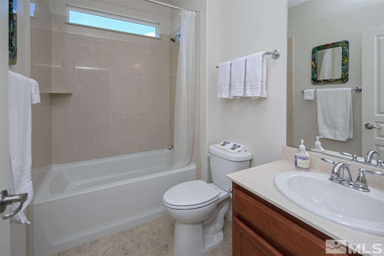1420 Wakefield Trail Reno, NV 89523 - Photo 16 of 23 a bathroom with a sink toilet and shower