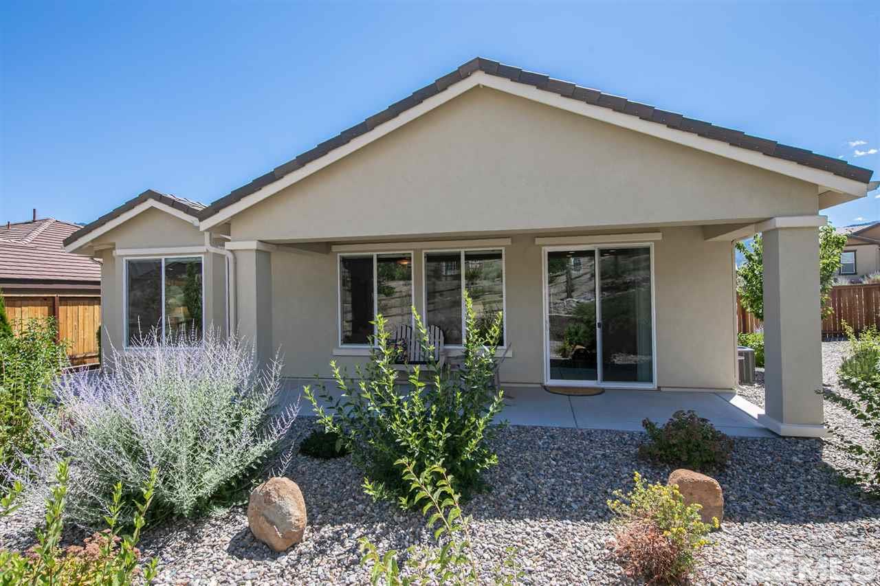 1420 Wakefield Trail Reno, NV 89523 - Photo 2 of 23 a front view of a house with a garden