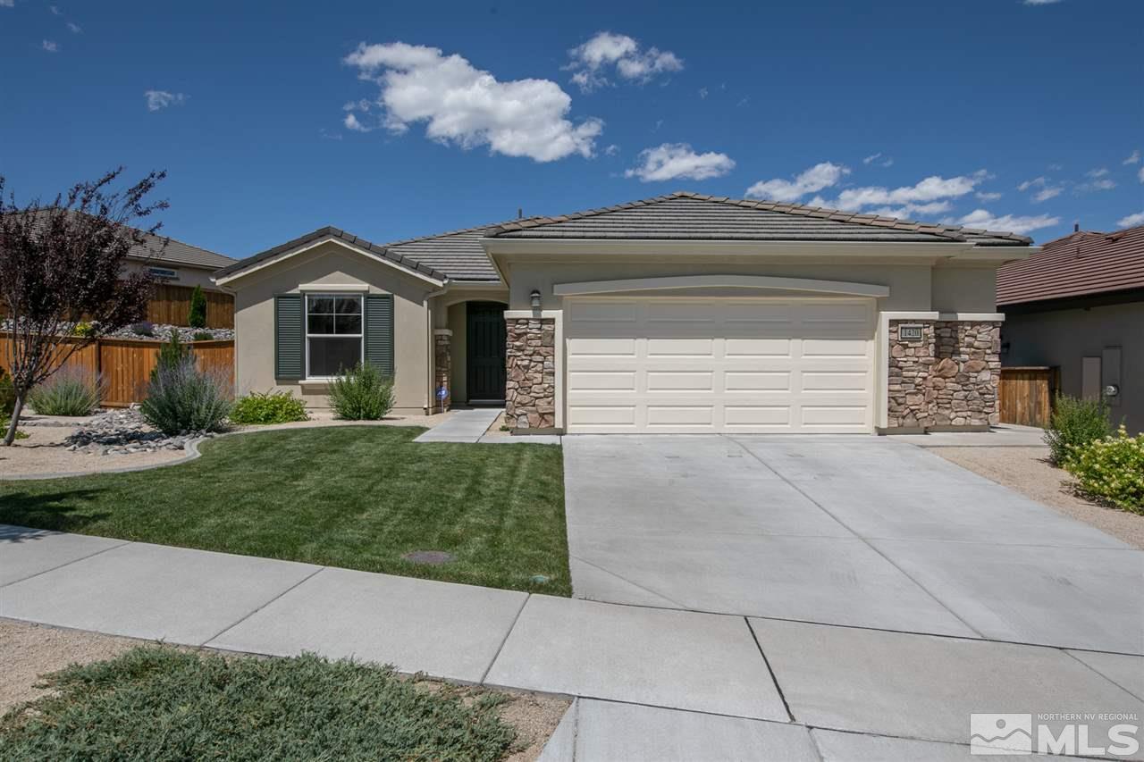 1420 Wakefield Trail Reno, NV 89523 - Photo 22 of 23 a front view of a house with a yard and a garage