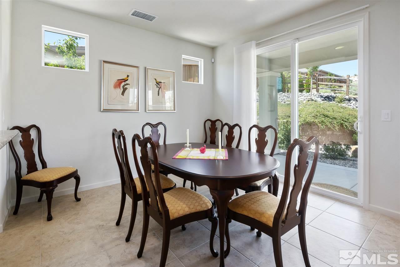 1420 Wakefield Trail Reno, NV 89523 - Photo 9 of 23 a view of a dining room with furniture and wooden floor