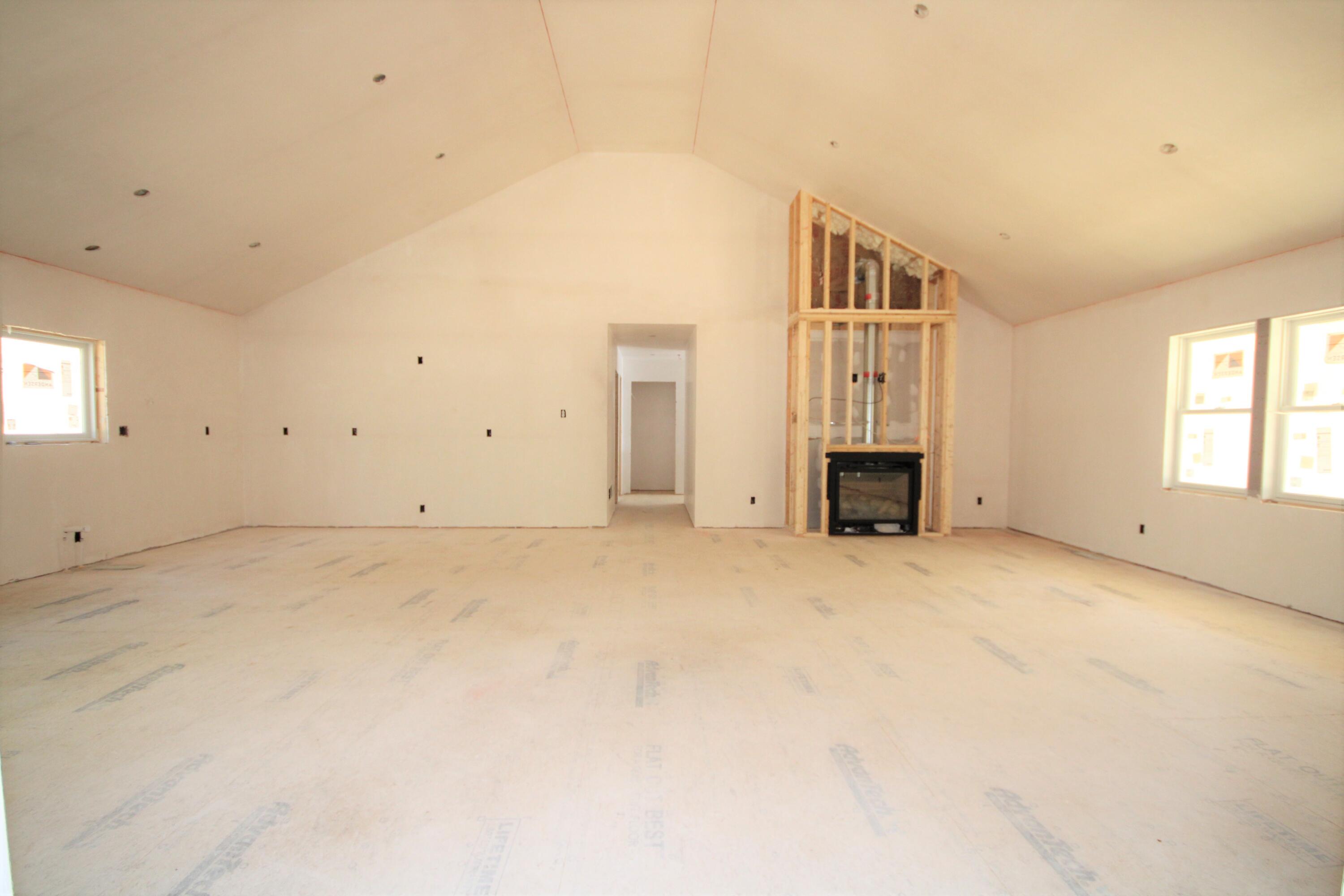 61 Lewis Neck Road East Falmouth, MA 02536 - Photo 24 of 37 an empty room with fireplace and windows