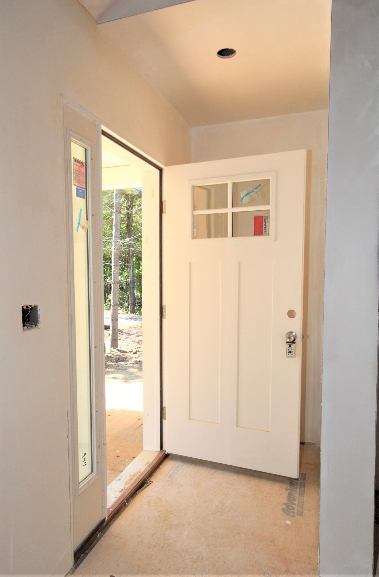 61 Lewis Neck Road East Falmouth, MA 02536 - Photo 3 of 37 a view of an empty room with a window