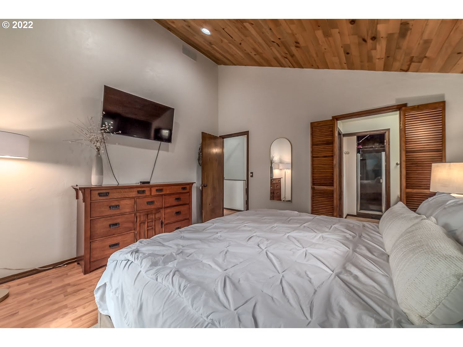 447 Cascade Drive Springfield, OR 97478 - Photo 16 of 32 a bedroom with a bed and a flat screen tv
