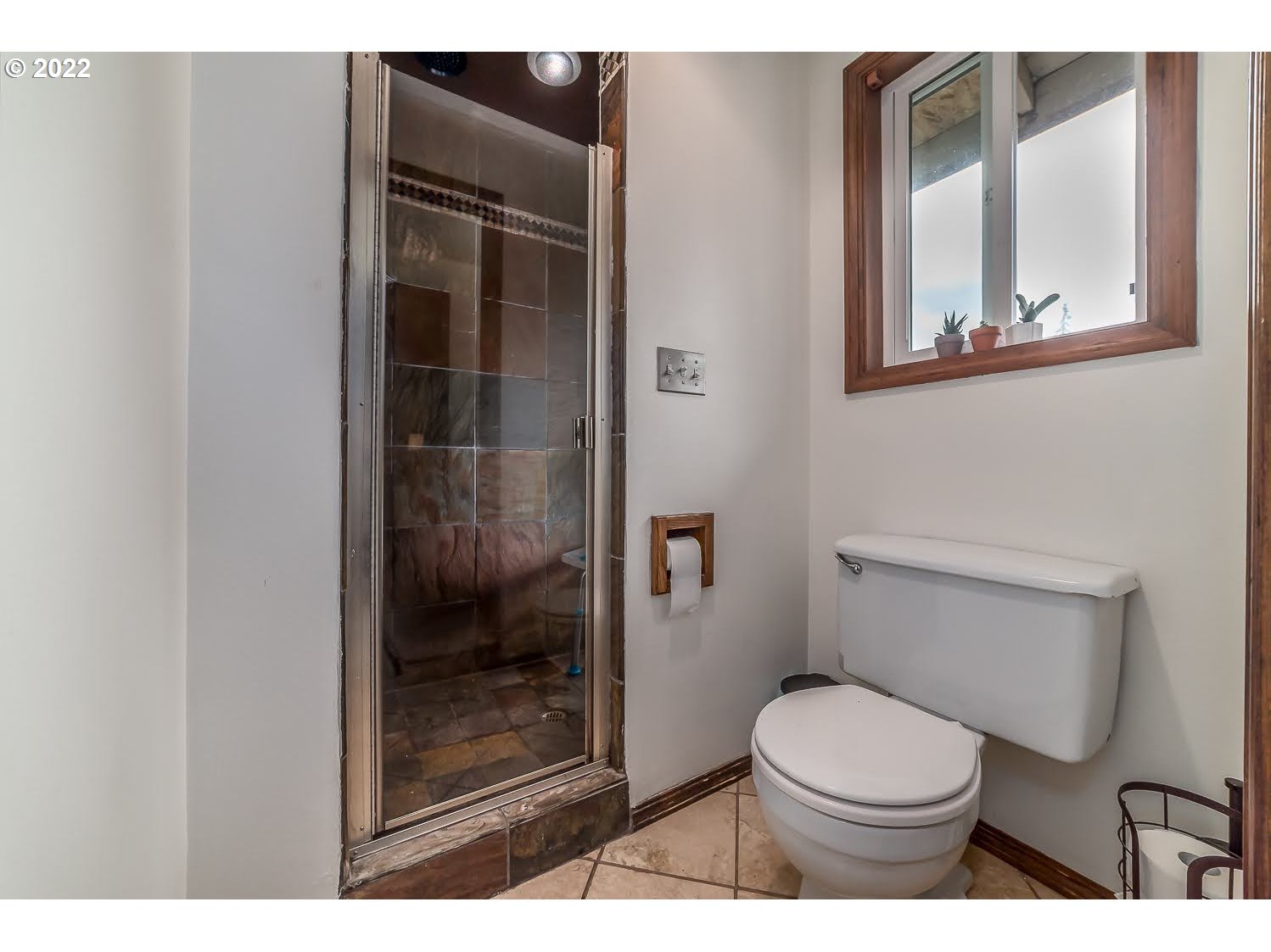 447 Cascade Drive Springfield, OR 97478 - Photo 18 of 32 a bathroom with a toilet and a shower