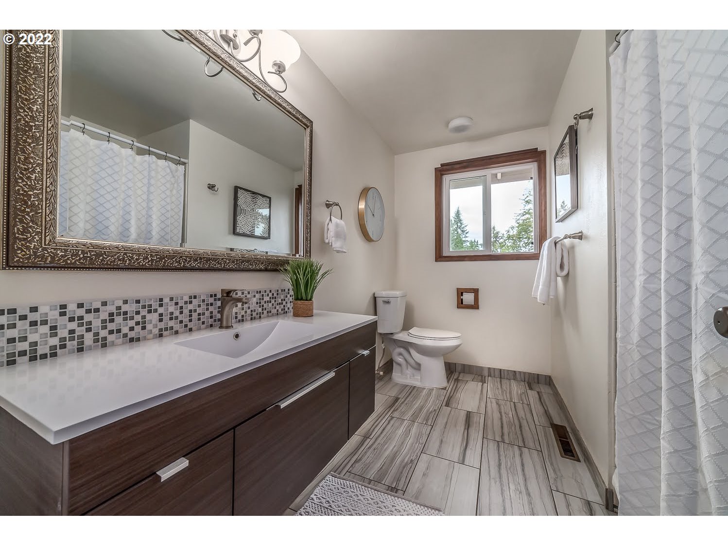 447 Cascade Drive Springfield, OR 97478 - Photo 21 of 32 a bathroom with a sink and a mirror
