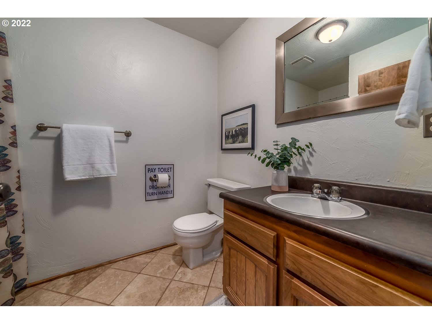 447 Cascade Drive Springfield, OR 97478 - Photo 26 of 32 a bathroom with a granite countertop sink and a mirror