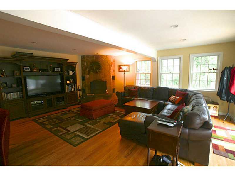 4 Florence Road Riverside, CT 06878 - Photo 13 of 25 a living room with furniture and a flat screen tv