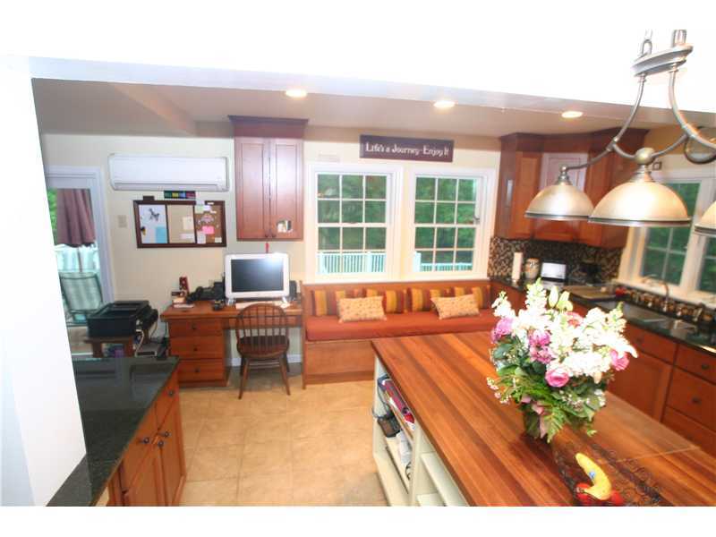 4 Florence Road Riverside, CT 06878 - Photo 10 of 25 a living room with furniture a chandelier and a wooden floor