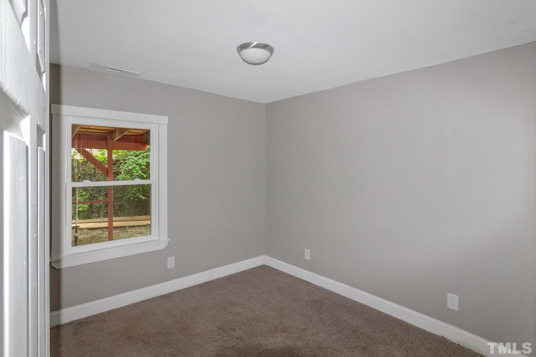 1401 Robinhood Road Durham, NC 27701 - Photo 12 of 14 an empty room with a window
