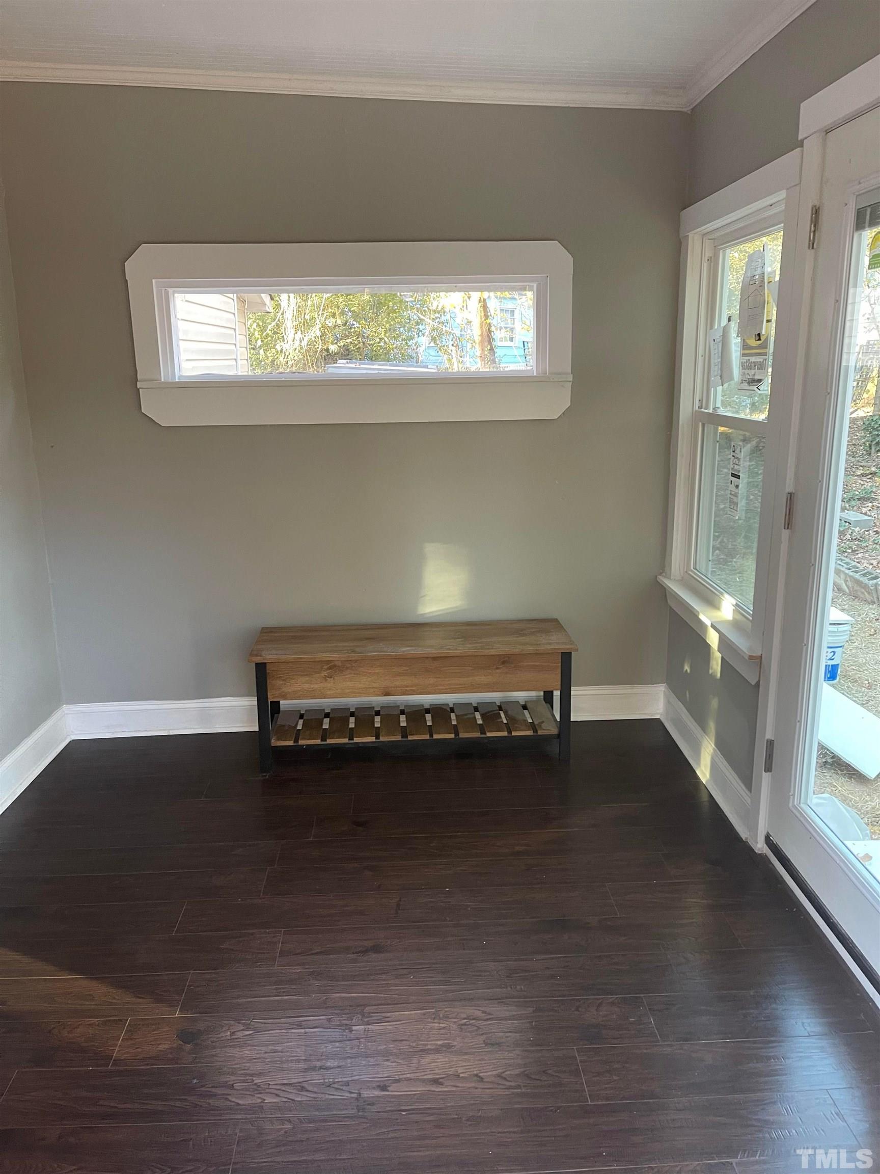 1401 Robinhood Road Durham, NC 27701 - Photo 3 of 14 a room with a wooden floor and a window
