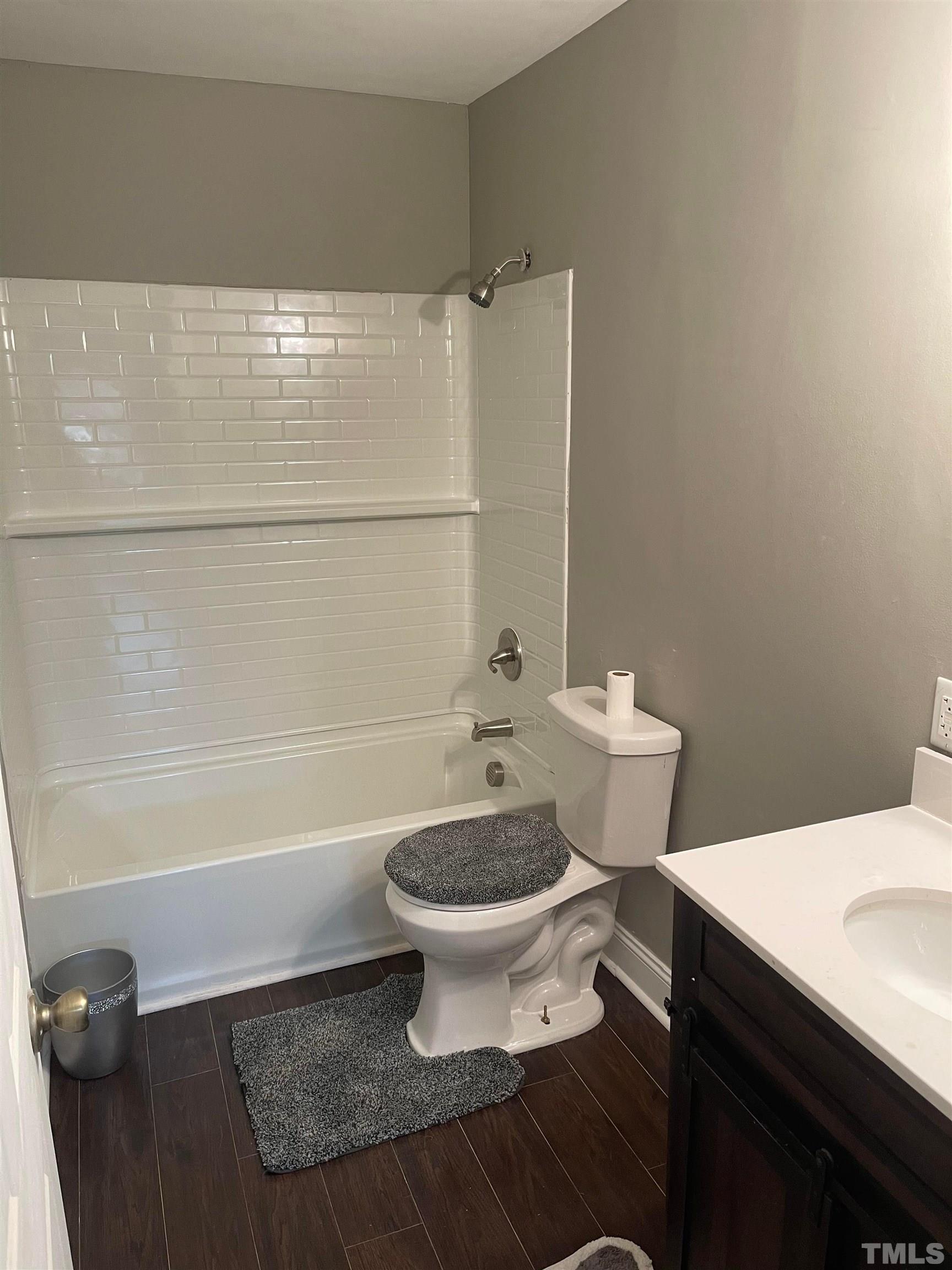 1401 Robinhood Road Durham, NC 27701 - Photo 5 of 14 a bathroom with a sink a toilet and a bathtub