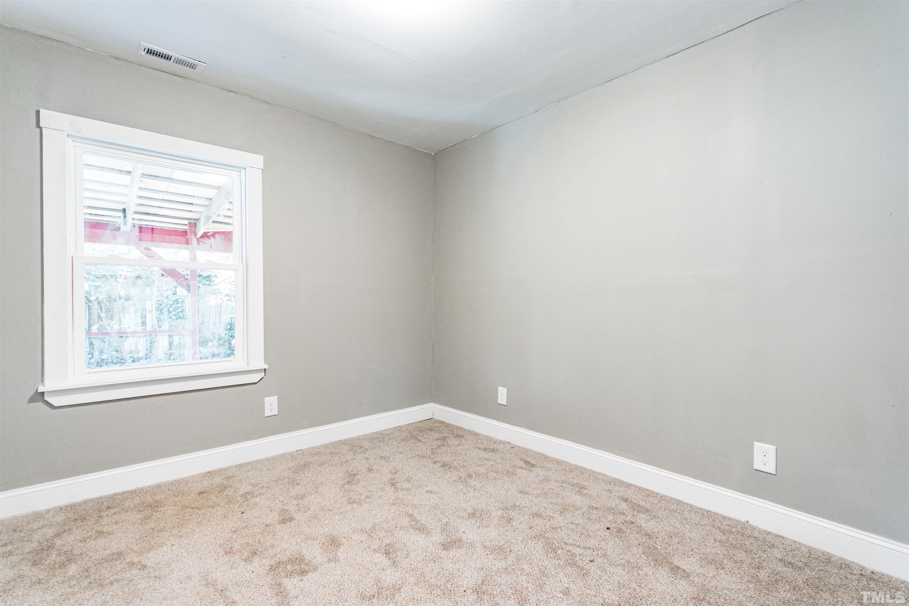 1401 Robinhood Road Durham, NC 27701 - Photo 6 of 14 an empty room with a window