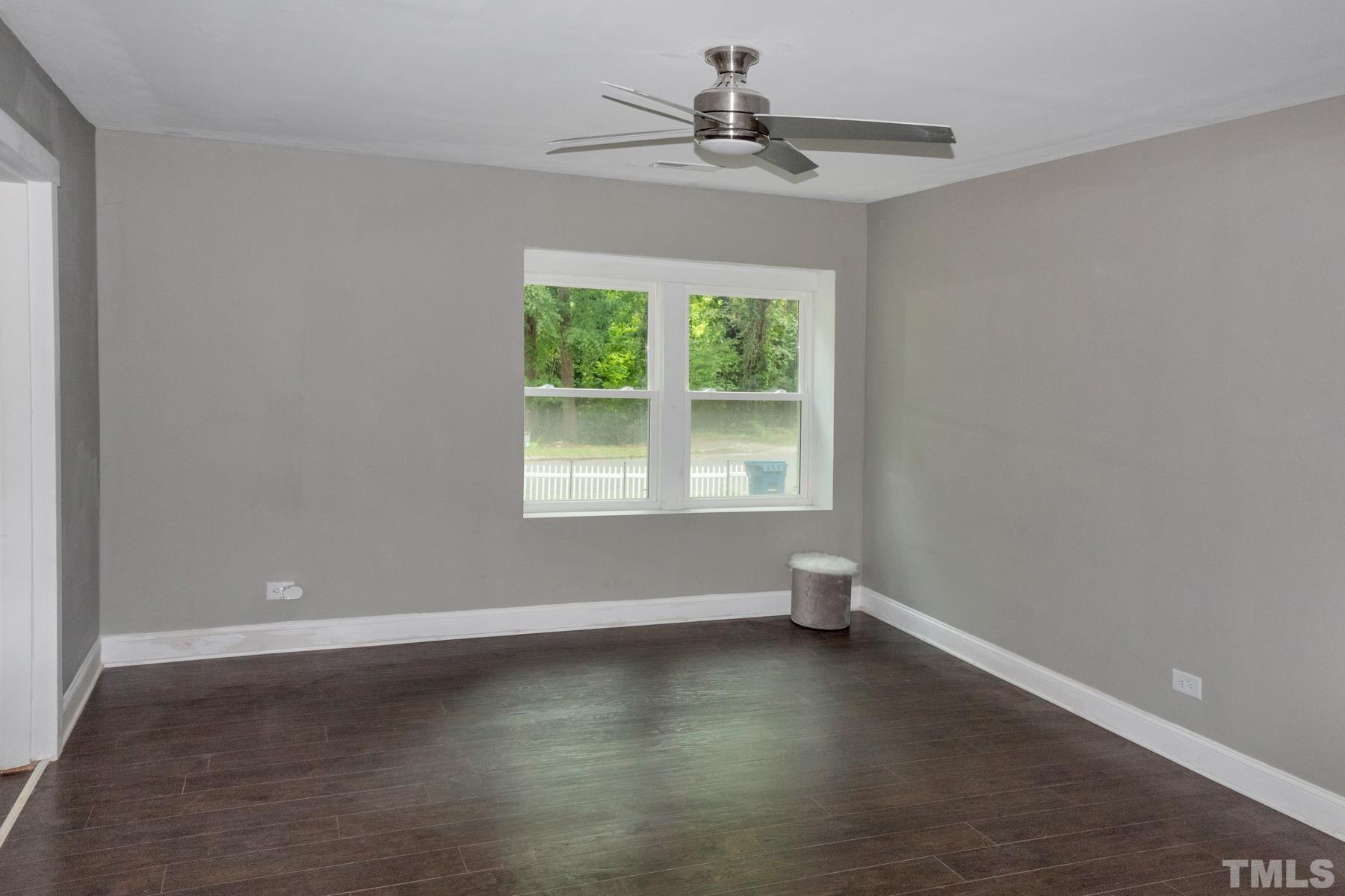 1401 Robinhood Road Durham, NC 27701 - Photo 7 of 14 a view of room with window and ceiling fan