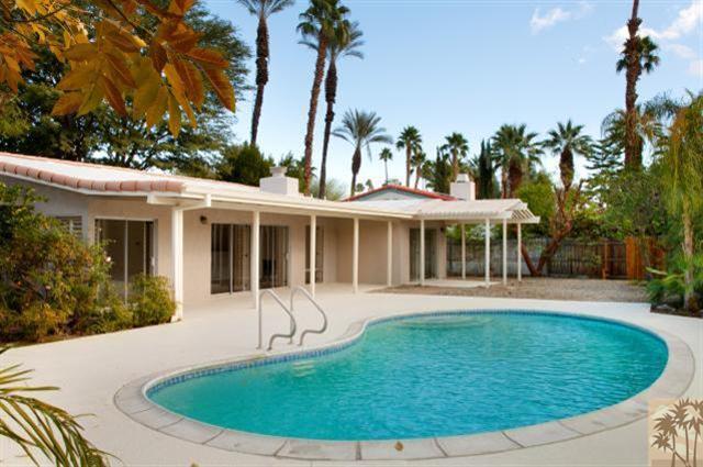 70415 Cobb Road Rancho Mirage, CA 92270 - Photo 1 of 23 a view of a house with a backyard porch and sitting area
