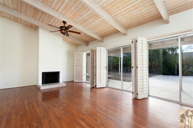 70415 Cobb Road Rancho Mirage, CA 92270 - Photo 6 of 23 a view of a livingroom with wooden floor and a ceiling fan