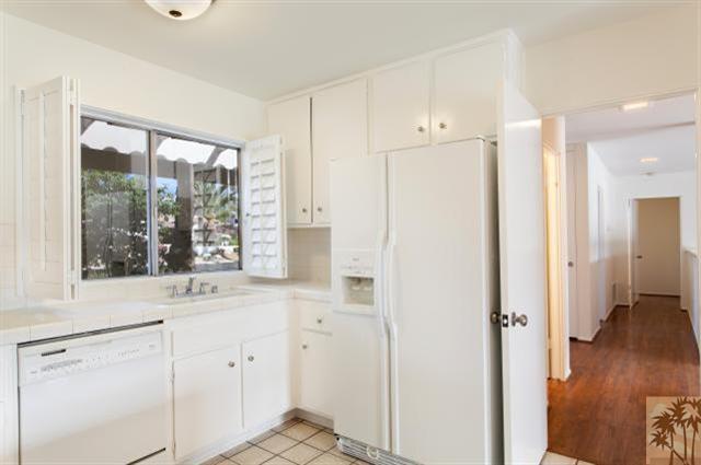 70415 Cobb Road Rancho Mirage, CA 92270 - Photo 10 of 23 a view of a kitchen with a sink a refrigerator and window