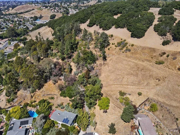 a view of a dry yard covered with snow