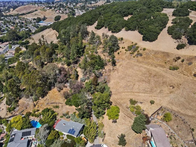 a view of a dry yard covered with snow