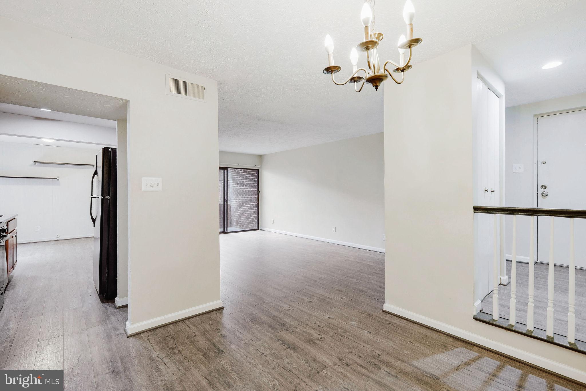 11240 Cherry Hill Road, Unit 18 Beltsville, MD 20705 - Photo 12 of 28 a view of a room with wooden floor