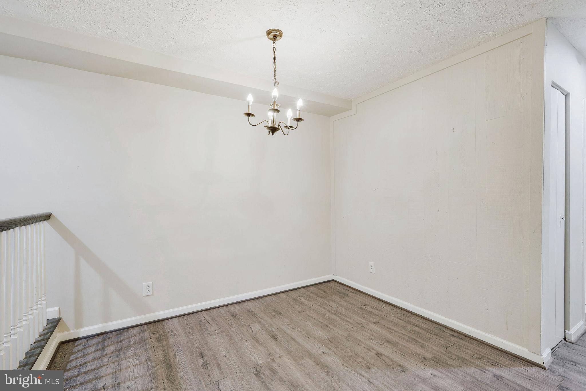 11240 Cherry Hill Road, Unit 18 Beltsville, MD 20705 - Photo 13 of 28 a view of a room with wooden floor and ceiling fan