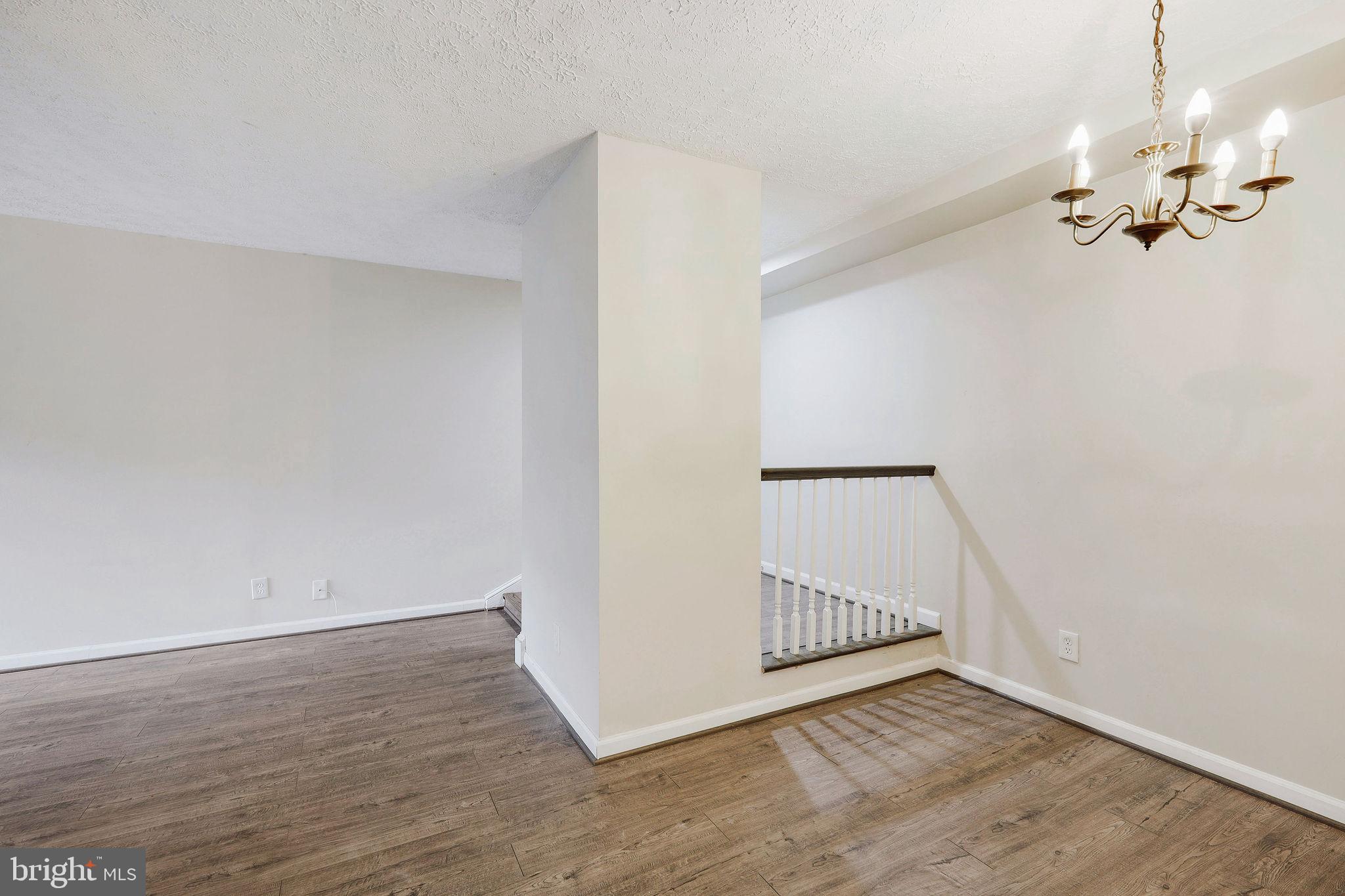 11240 Cherry Hill Road, Unit 18 Beltsville, MD 20705 - Photo 14 of 28 a view of a room with wooden floor and staircase