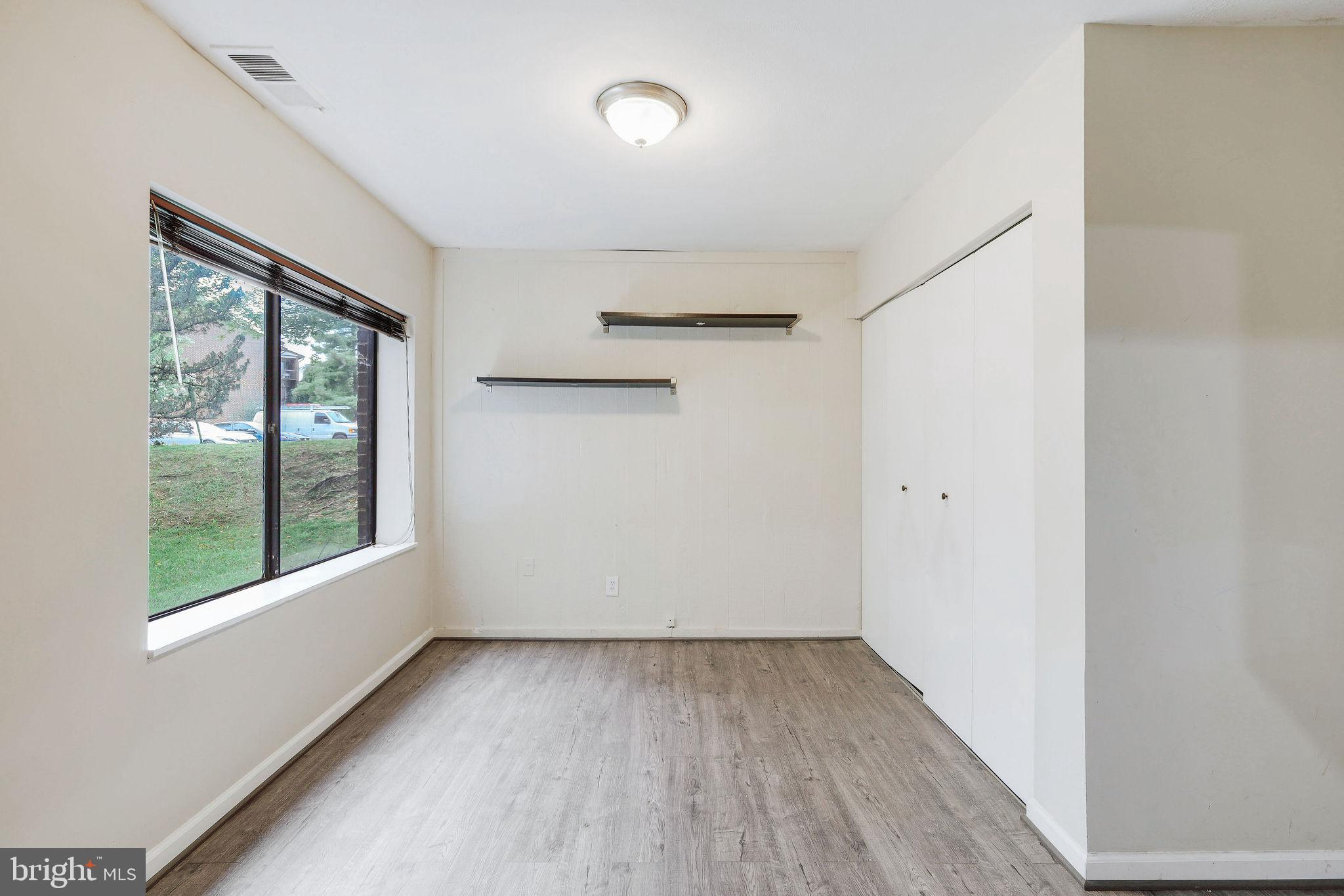 11240 Cherry Hill Road, Unit 18 Beltsville, MD 20705 - Photo 20 of 28 an empty room with a window