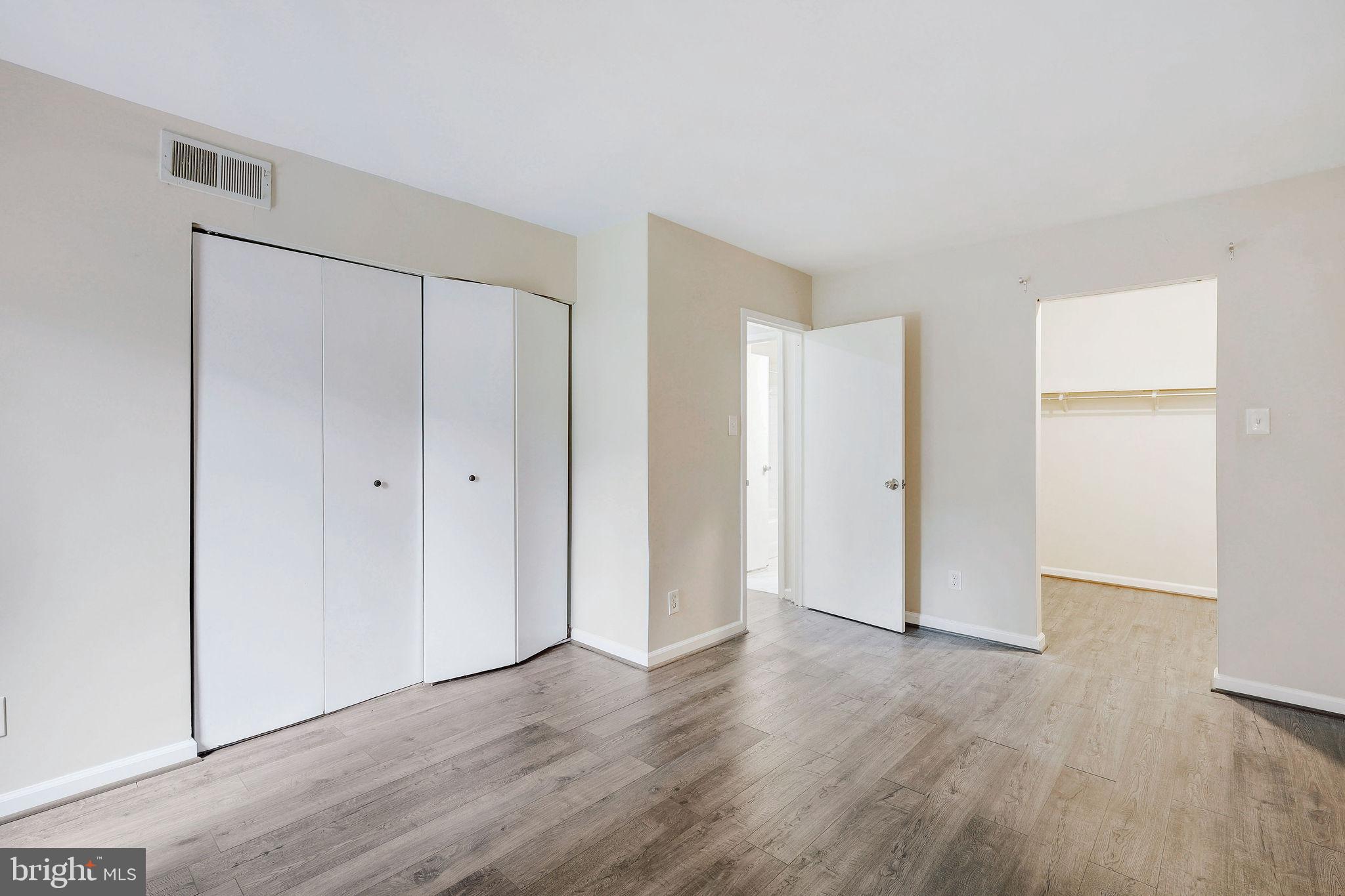 11240 Cherry Hill Road, Unit 18 Beltsville, MD 20705 - Photo 23 of 28 a view of an empty room with wooden floor