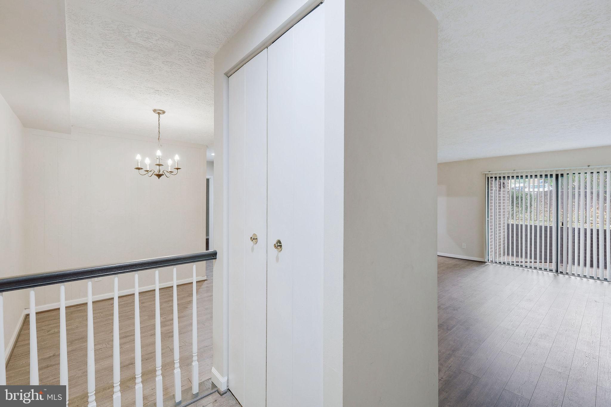 11240 Cherry Hill Road, Unit 18 Beltsville, MD 20705 - Photo 6 of 28 a view of a hallway with wooden floor