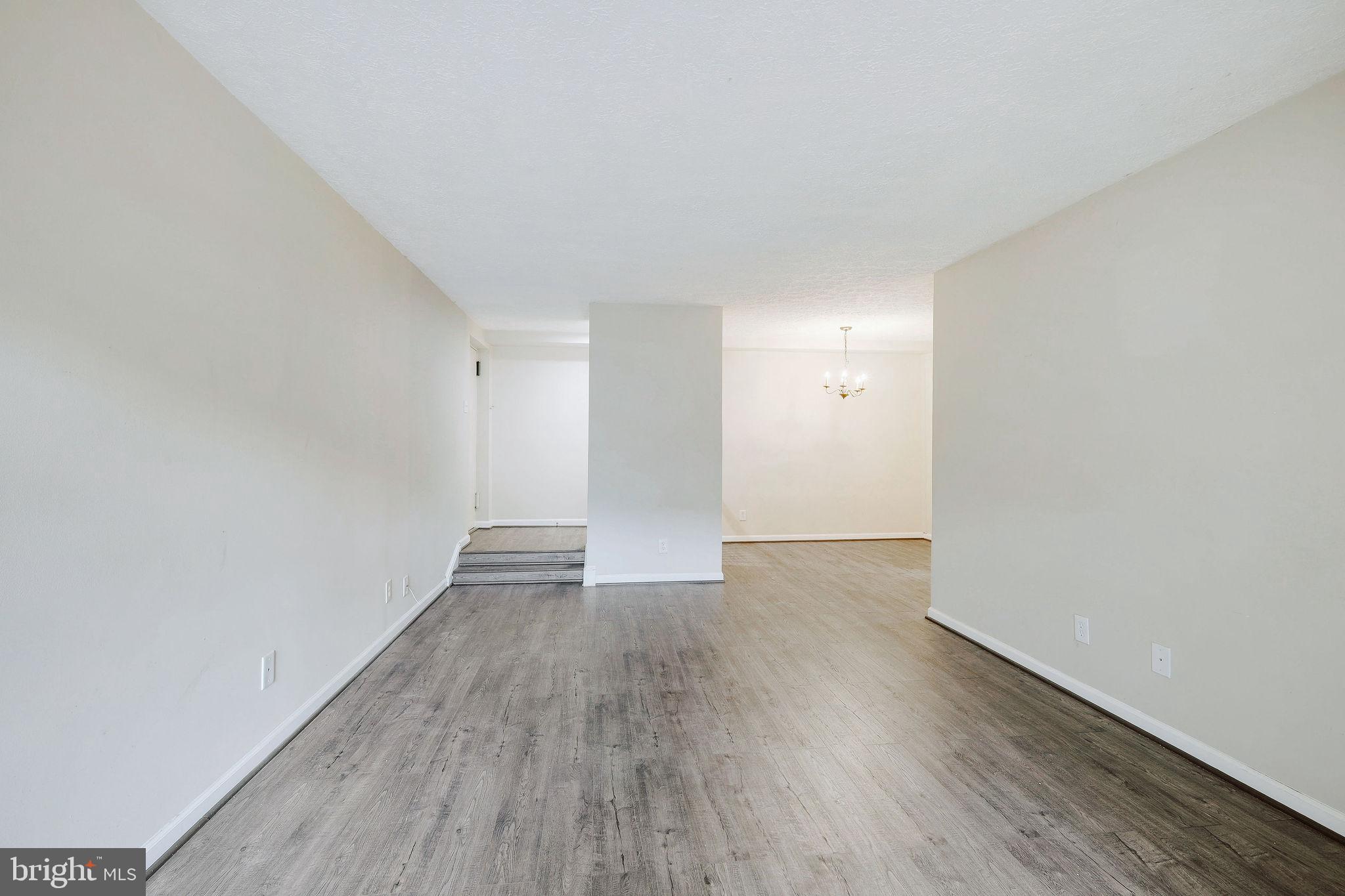 11240 Cherry Hill Road, Unit 18 Beltsville, MD 20705 - Photo 8 of 28 a view of an empty room and wooden floor