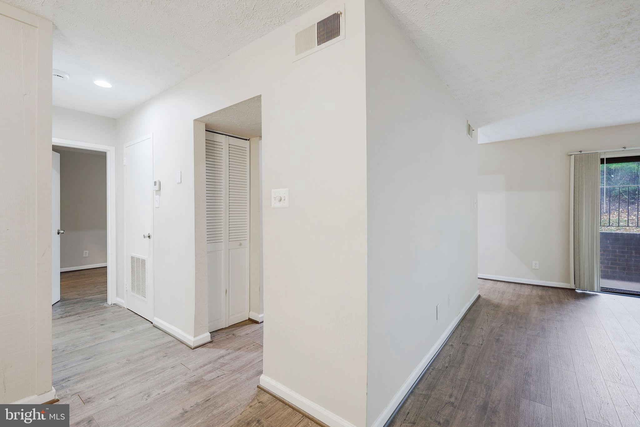 11240 Cherry Hill Road, Unit 18 Beltsville, MD 20705 - Photo 9 of 28 a view of hallway with wooden floor