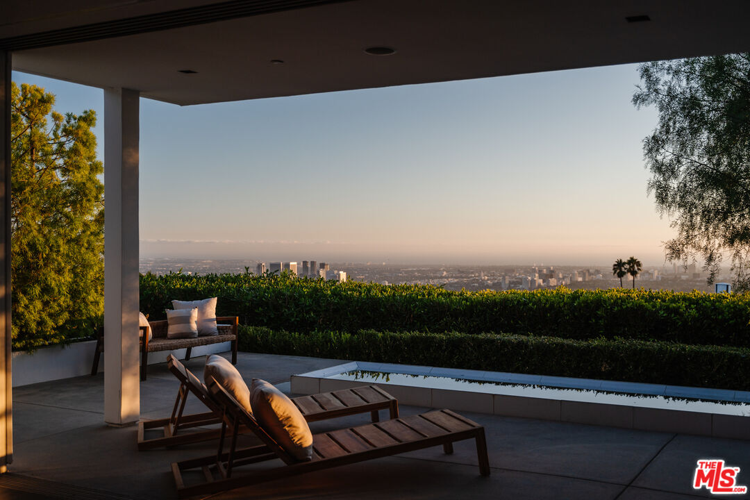 551 Chalette Drive Beverly Hills, CA 90210 - Photo 1 of 1 a view of a terrace with furniture and a garden