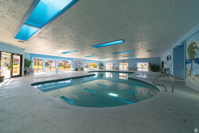2212 Chippenham Court St. George, UT 84770 - Photo 42 of 75 Indoor community pool featuring a jacuzzi and a skylight