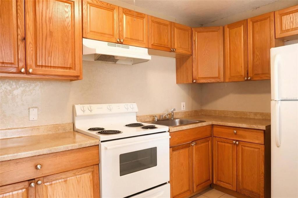 1105 West Nassau Street Tampa, FL 33607 - Photo 14 of 22 a kitchen with stainless steel appliances granite countertop a stove a sink and a microwave