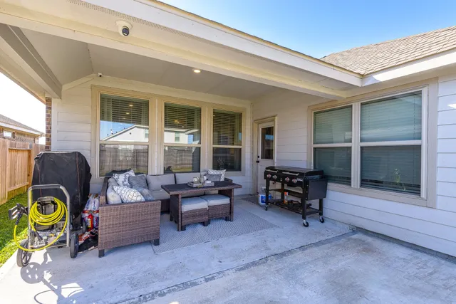 a living room with furniture and a window