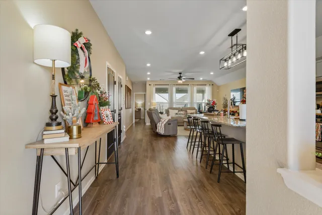 a view of a dining room with furniture and wooden floor