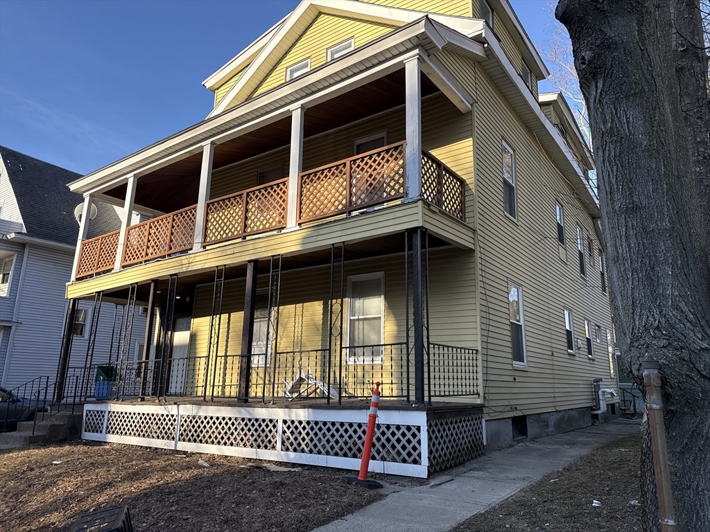 59 Dover Street Worcester, MA 01609 - Photo 2 of 11 a front view of a house with a yard