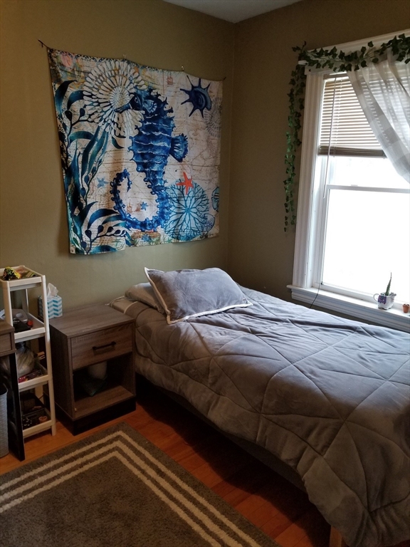 59 Dover Street Worcester, MA 01609 - Photo 7 of 11 a bedroom with a bed and a window