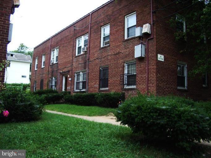 4819 Sheriff Road Northeast Washington, DC 20019 - Photo 1 of 1 a brick building view that has a lots of windows in it