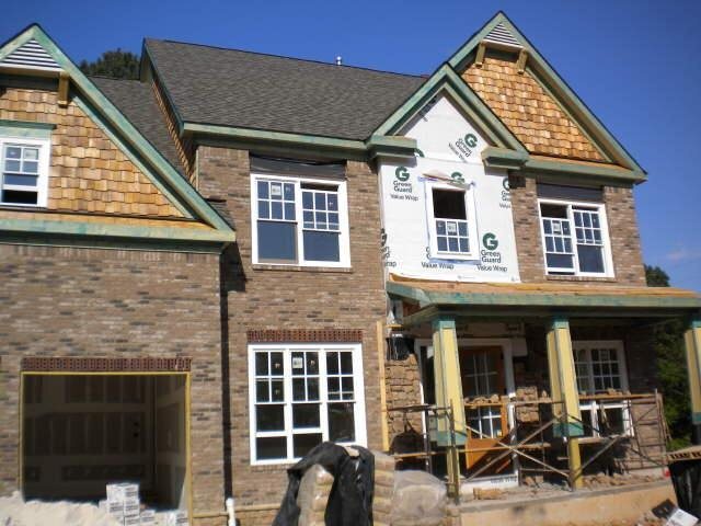 2235 Watercrest Commons Circle, Unit 9 Marietta, GA 30062 - Photo 1 of 1 a front view of a house with many windows