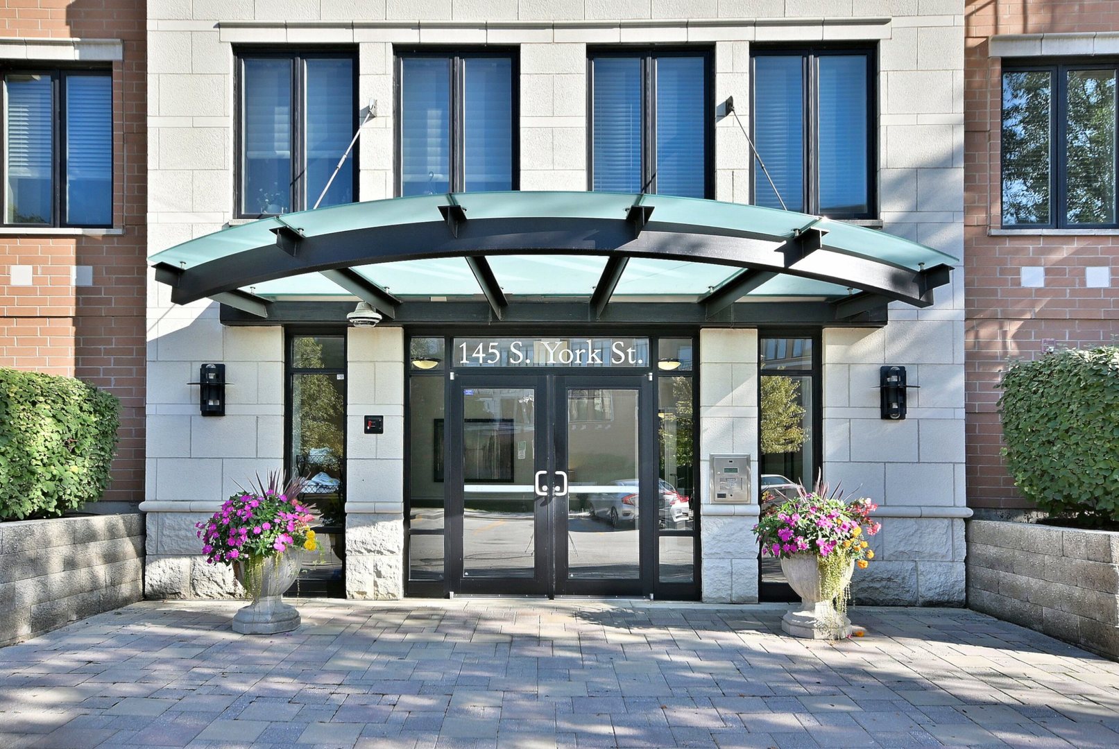 145 South York Street, Unit 404 Elmhurst, IL 60126 - Photo 2 of 28 a view of a house with patio