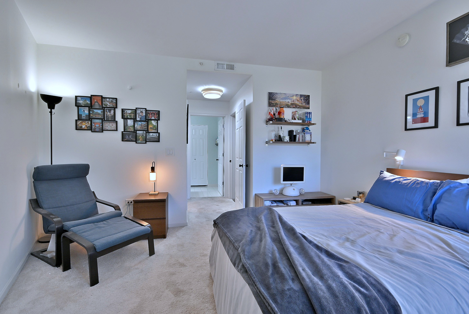 145 South York Street, Unit 404 Elmhurst, IL 60126 - Photo 26 of 28 a bedroom with a bed and a chair