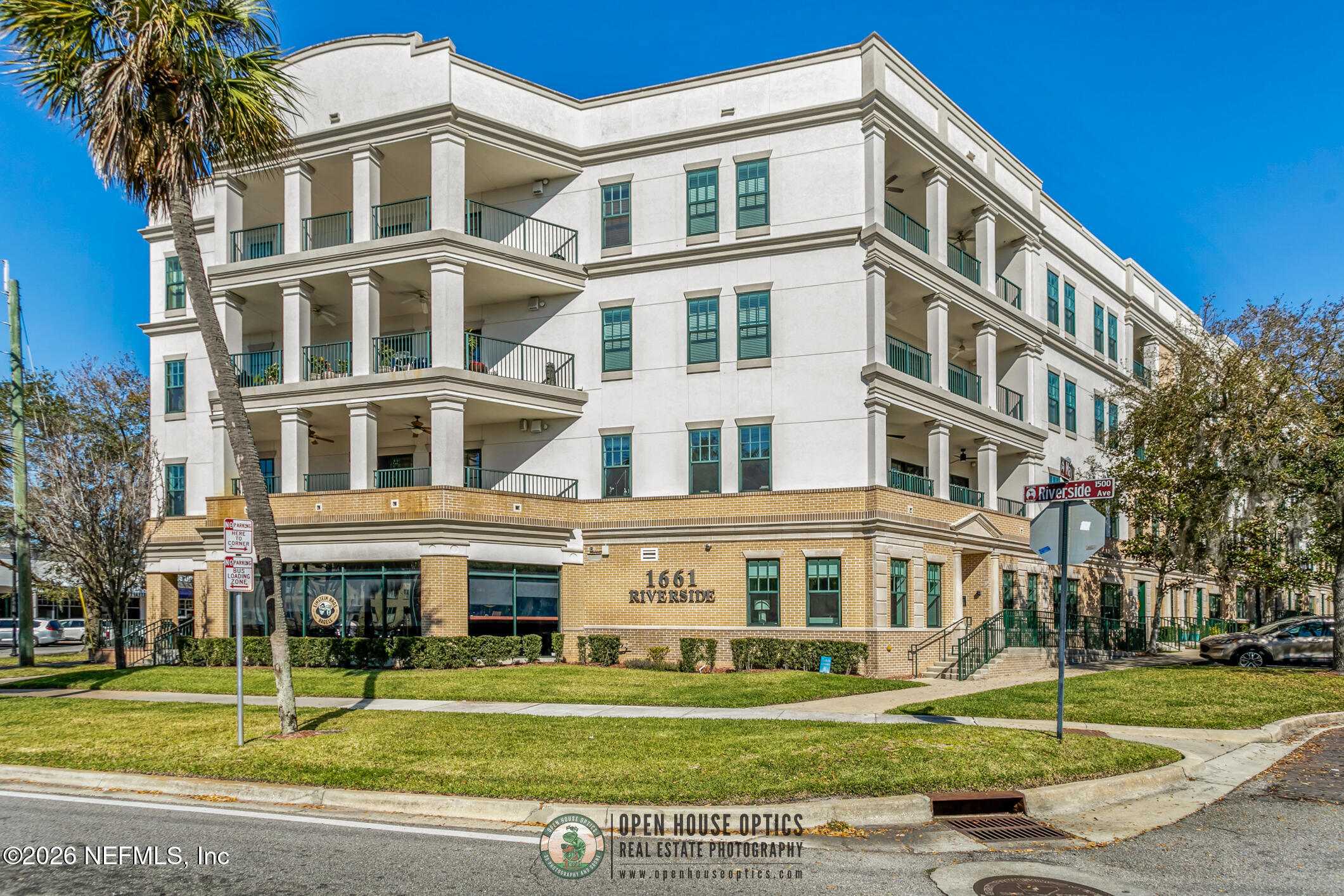 1661 Riverside Avenue, Unit 407 Jacksonville, FL 32204 - Photo 37 of 60 a front view of a building with a yard