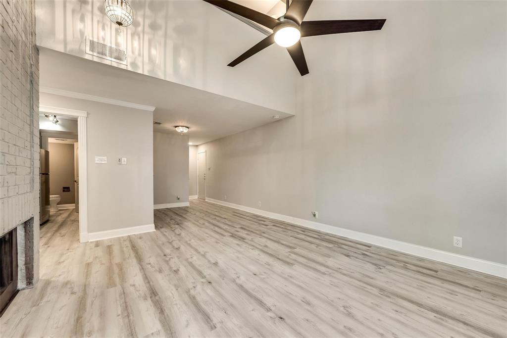 18240 Midway Road, Unit 302 Dallas, TX 75287 - Photo 6 of 33 wooden floor in an empty room
