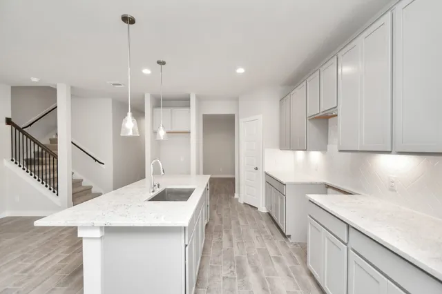 a bathroom with a sink a toilet and bathtub