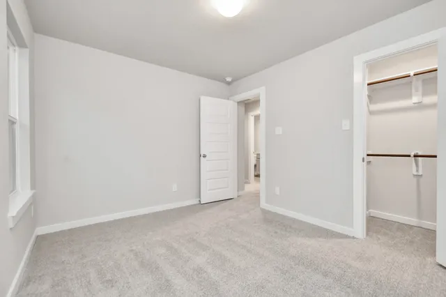 a view of a backyard with table and chairs